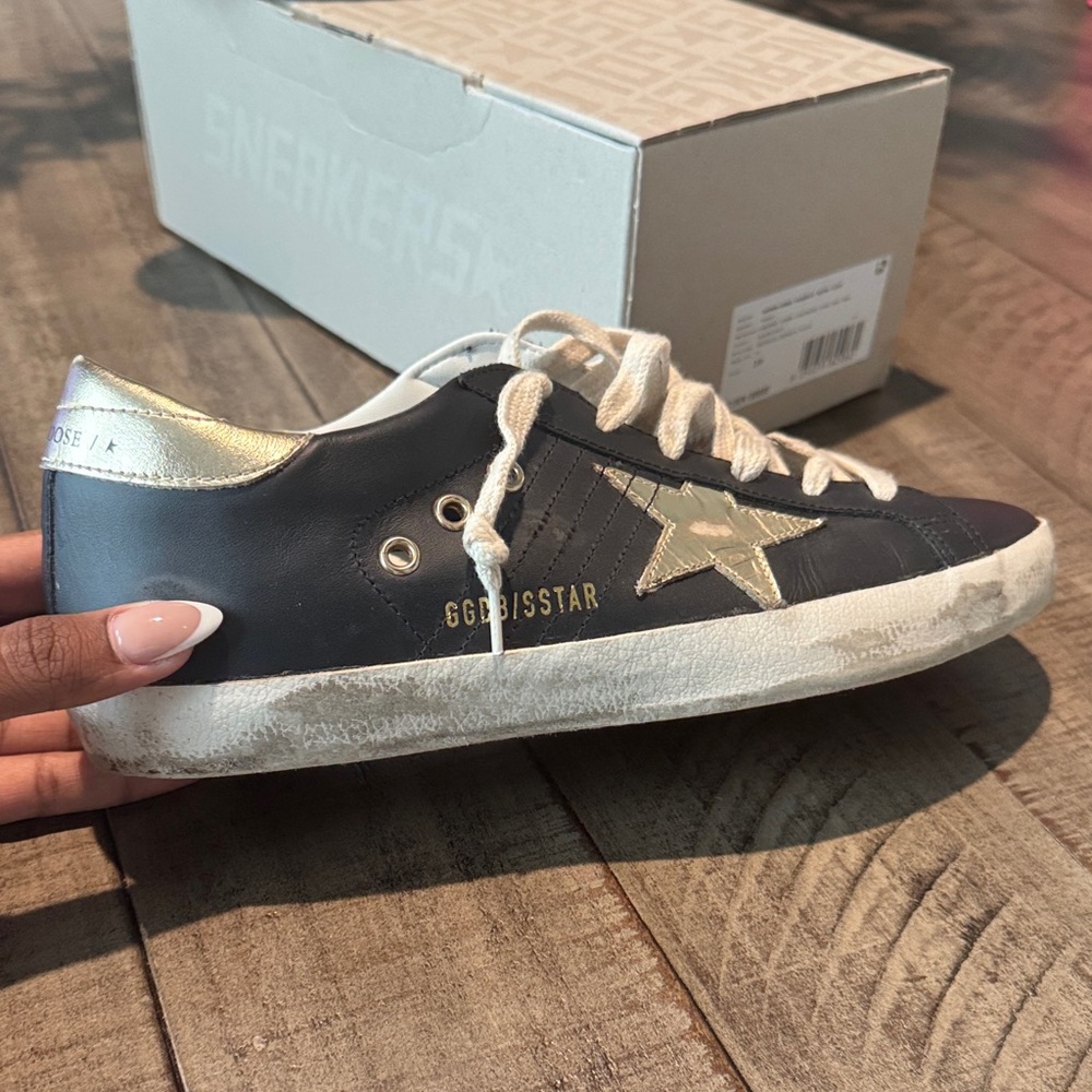 Golden Goose Black and Gold Super Star Classic Sneakers